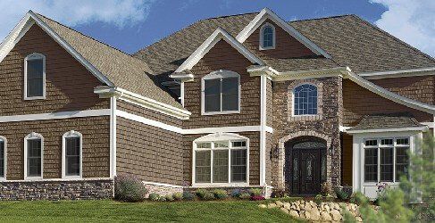 NORTHWOODS Single 9″ Staggered Rough-Split Shakes shown on a home