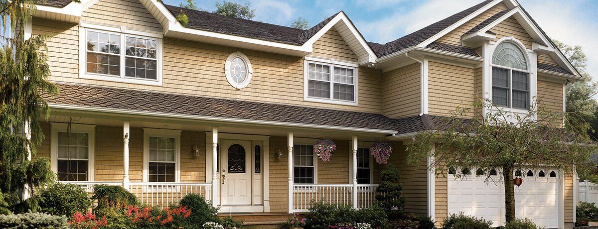 CEDAR IMPRESSIONS Triple 5″ Straight Edge Sawmill Shingles shown on a home