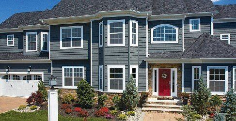 CEDAR IMPRESSIONS Triple 5″ Straight Edge Perfection Shingles shown on a home