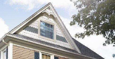 CEDAR IMPRESSIONS 6 1/4″ Half-Round Shingles shown on a home